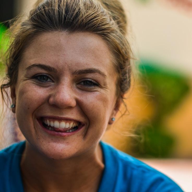 Kaveri Mehta, Lead Design Curator at AptPixelBalance, reviewing corporate floral arrangements